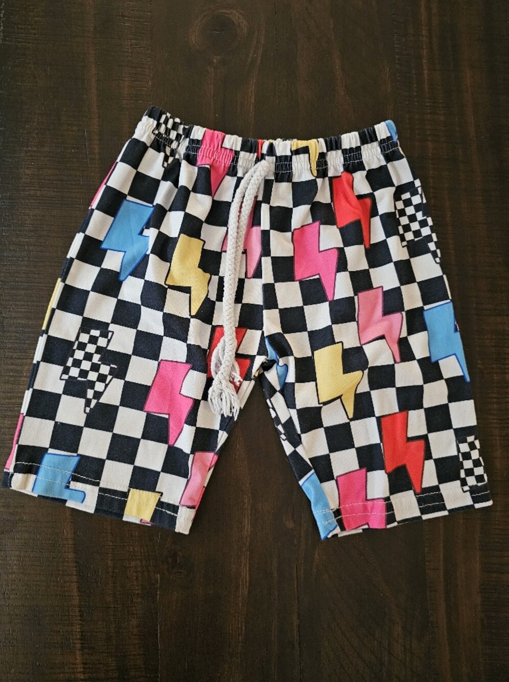 Kids Black Checkered Pajama Shorts with Pink, Blue & Yellow Lightning Bolts